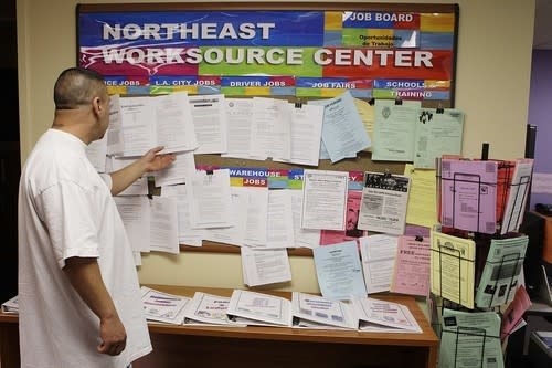 Joe Marquez, a former sheet metal worker from La Habra, looks for jobs at the One-Stop center in East Los Angeles. The Legislature-approved money will be an immediate lifeline for 76,000 people whose benefits were set to run out April 11.