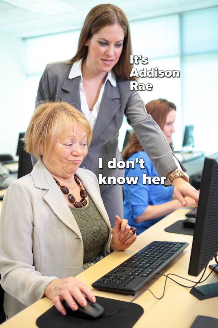 A computer teacher with the caption "It's Addison Rae" shows a senior woman with the caption "I don't know her" how to perform a task in the new accounting software