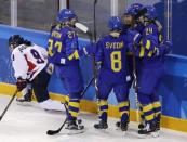 Ice Hockey - Pyeongchang 2018 Winter Olympics - Women’s Classification Match - Sweden v Korea - Kwandong Hockey Centre, Gangneung, South Korea - February 20, 2018 - Erika Grahm of Sweden celebrates with teammates after scoring. REUTERS/David W Cerny