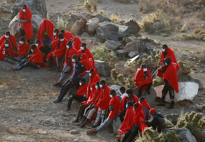 Group of immigrants is pictured at Las Carpinteras beach on the island of Gran Canaria