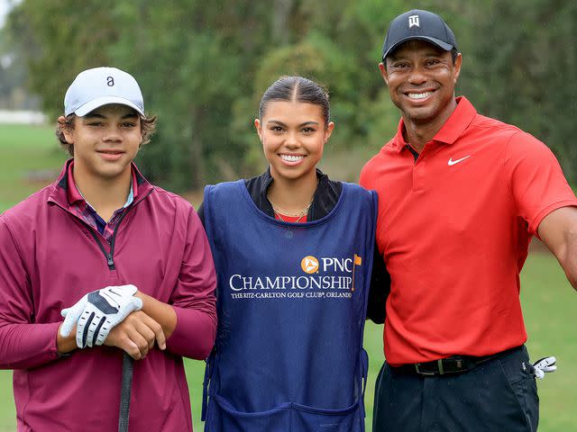 <p>David Cannon/Getty</p> Tiger Woods with his son Charlie Woods and his daughter Sam Woods who was caddying for Tiger during the final round of the PNC Championship on December 17, 2023 in Orlando, Florida.