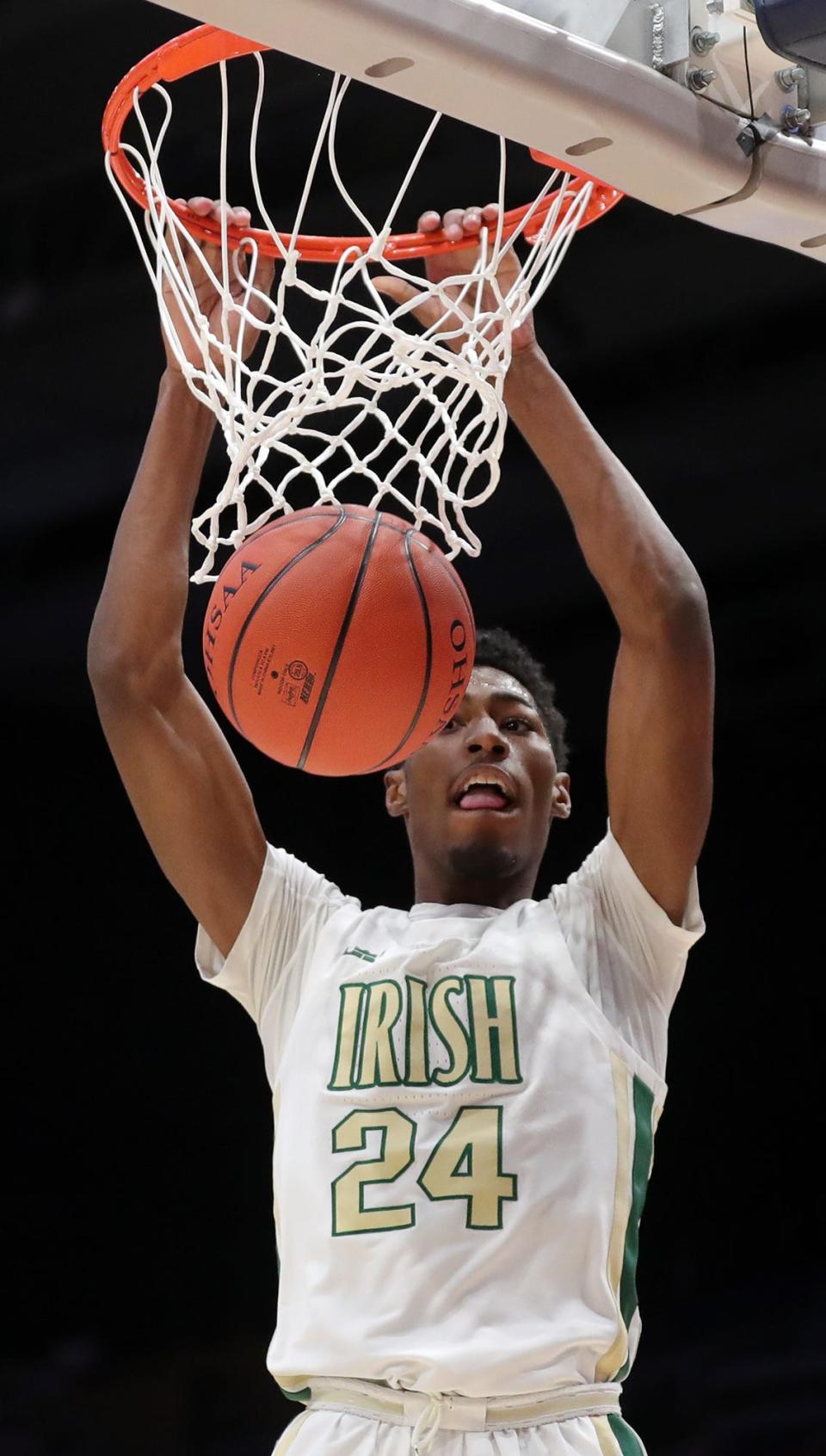 St. Vincent-St. Mary senior guard Sencire Harris throws down a dunk in the first half of a 63-35 win over Gilmour Academy in the Division II state championship game Sunday at the University of Dayton Arena. [Jeff Lange/Beacon Journal]