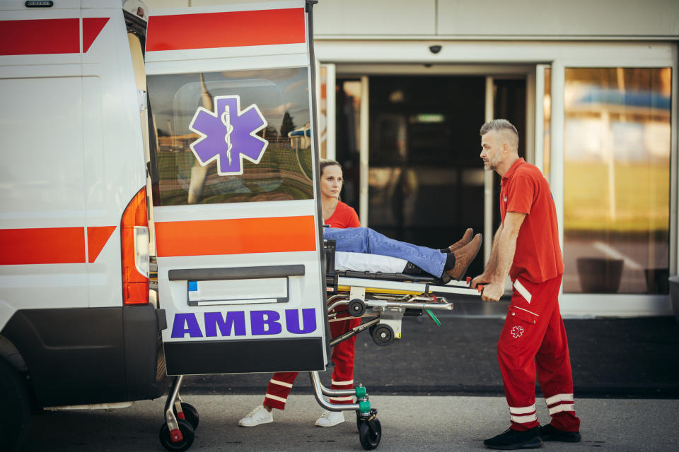 person being carried in a stretcher