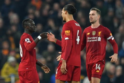 Sadio Mane (left) celebrates the only goal as Liverpool beat Wolves 1-0