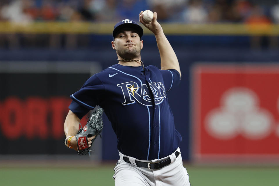 FILE - Tampa Bay Rays starting pitcher Shane McClanahan throws to a Baltimore Orioles batter during the first inning of a baseball game July 22, 2023, in St. Petersburg, Fla. McClanahan and Randy Arozarena are among eight players who agreed to contracts with the Rays on Thursday, Jan. 11, 2024, and avoided arbitration. (AP Photo/Scott Audette, File)