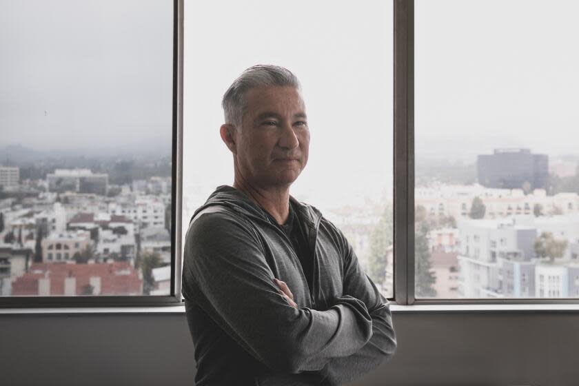 Los Angeles, CA - May 15: Chuck Martinez, a tenant at Barrington Plaza, where owners have served the residents of 577 occupied rent-controlled units with eviction notices, poses for a portrait on Monday, May 15, 2023 in Los Angeles, CA. (Jason Armond / Los Angeles Times)