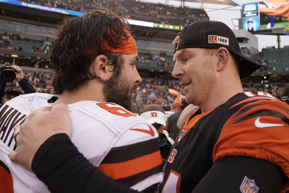 Cincinnati Bengals quarterback Andy Dalton, right, and Cleveland Browns quarterback Baker Mayfield talk after the Bengals defeated the Browns in an NFL football game, Sunday, Dec. 29, 2019, in Cincinnati. (AP Photo/Bryan Woolston)