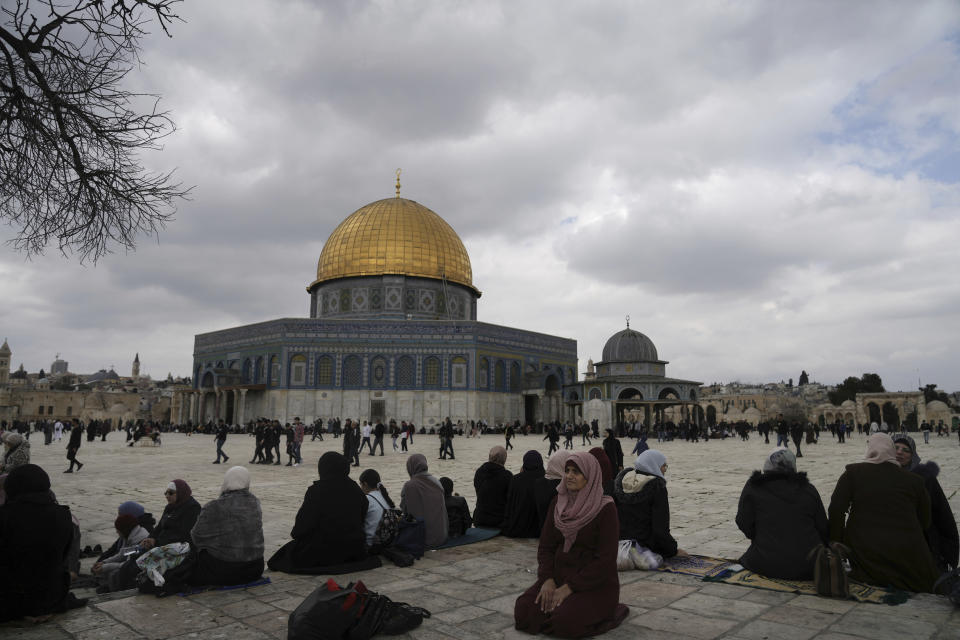 Muslims take part in Friday prayers at the Dome of the Rock Mosque in the Al-Aqsa Mosque compound in the Old City of Jerusalem, Friday, Feb. 24, 2023. (AP Photo/Mahmoud Illean)