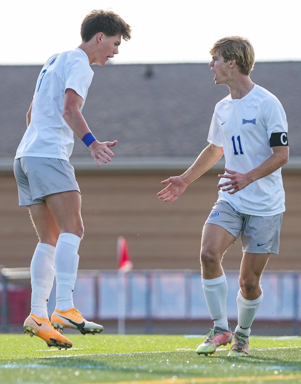 Hamilton Southeastern Royals Logan Puls (9) and Hamilton Southeastern Royals midfielder Logan Wright (11) celebrates a goal Wednesday, Oct. 5, 2022, at Fishers High School in Fishers. The Hamilton Southeastern Royals defeated the Fishers Tigers, 2-4. 