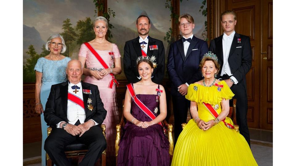 Norway's Princess Ingrid Alexandra (front C) poses for a family photo with (front L and R) Norway's King Harald V and Norway's Queen Sonja and (back LtoR) Marit Tjessem, Norway's Crown Princess Mette-Marit, Norway's Crown Prince Haakon, Norway's Prince Sverre Magnus and Marius Borg Hoiby