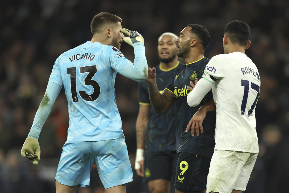 Tottenham's goalkeeper Guglielmo Vicario, left, argues with Newcastle's Callum Wilson during the English Premier League soccer match between Tottenham Hotspur and Newcastle United, at the Tottenham Hotspur Stadium, London, England, Sunday, Dec.10, 2023. (AP Photo/Ian Walton)