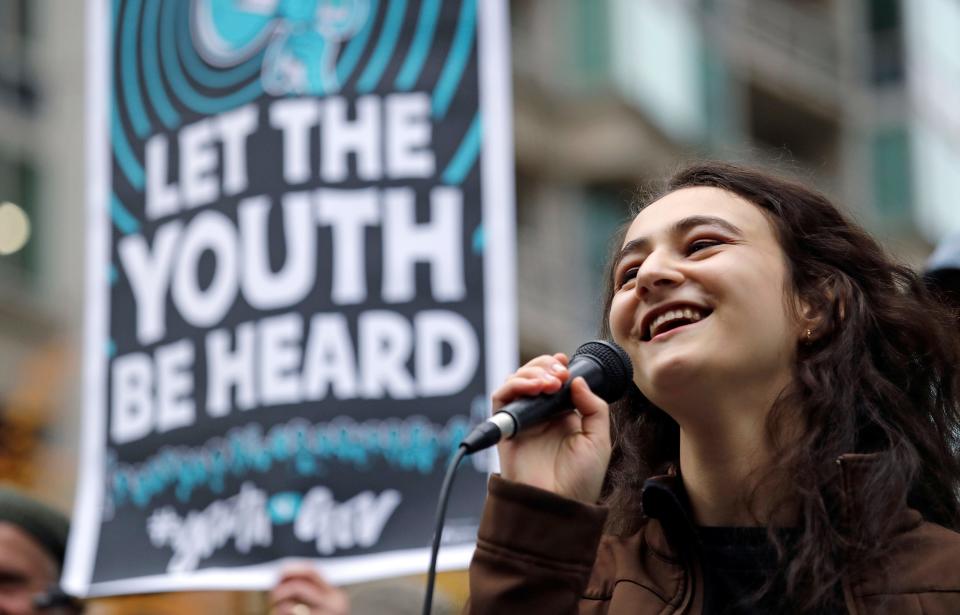 A high school student speaks during a climate rally held by youth activists.