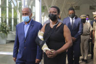 First Lady Martine Moise arrives for a tribute for her late husband President Jovenel Moise at the National Pantheon Museum in Port-au-Prince Haiti, Wednesday, July 21, 2021. President Moise was assassinated on July 7 during an attack at their home that left her injured. ( AP Photo/Joseph Odelyn)