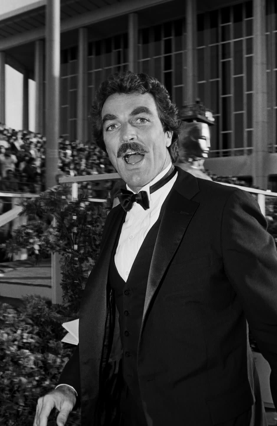 <p>A crowd of fans watch as <em>Magnum P.I. </em>star Tom Selleck makes a surprised face at the camera. The actor eventually won the Lead Actor Emmy in 1984.</p>