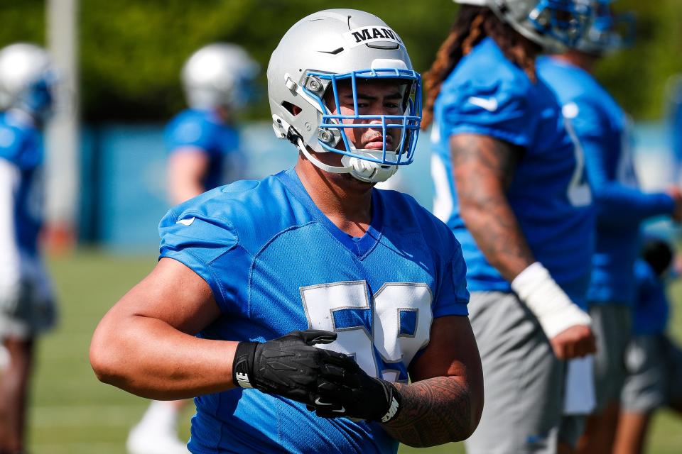 Detroit Lions offensive lineman Giovanni Manu (59) warms up during rookie minicamp at Detroit Lions headquarters and practice facility in Allen Park on Friday, May 10, 2024.