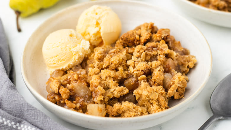 Pear crisp and ice cream in a bowl