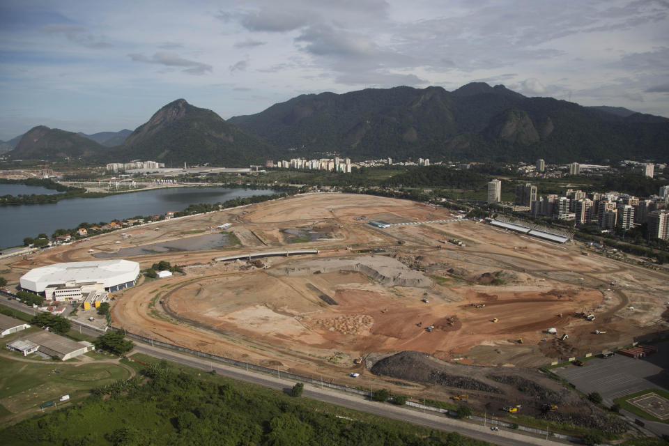 FILE- In this April 11, 2013 file photo, the Olympic Park, that will host competitions for 10 sports at Rio's Olympics in 2016, is under construction in the area previously occupied by the Jacarepagua Autodrome in Rio de Janeiro, Brazil. Rio de Janeiro's mayor Eduardo Paes says he expects federations to continue complaining about the city's preparations until the start of the games, but that he will not bow to their pressure and will keep his focus on securing a legacy for Rio well beyond Olympics. (AP Photo/Felipe Dana, File)