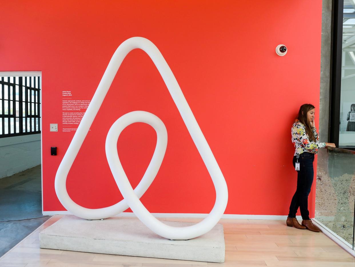 FILE PHOTO: A woman talks on the phone at the Airbnb office headquarters in the SOMA district of San Francisco, California, U.S., August 2, 2016.  REUTERS/Gabrielle Lurie