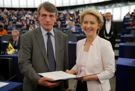 Elected European Commission President Ursula von der Leyen is congratulated by European Parliament President David-Maria Sassoli after a vote on her election at the European Parliament in Strasbourg