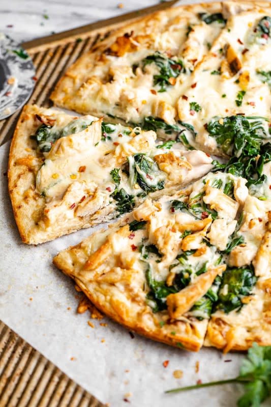 <p>Easy Weeknight Recipes</p><p>This perfect white pizza balances tender white meat chicken, vibrant and healthy spinach and cheesy alfredo sauce for a meal the whole family will crave.</p><p><strong>Get the recipe: <a href="https://easyweeknightrecipes.com/chicken-alfredo-pizza/" rel="nofollow noopener" target="_blank" data-ylk="slk:Chicken Alfredo Pizza;elm:context_link;itc:0;sec:content-canvas" class="link rapid-noclick-resp">Chicken Alfredo Pizza</a></strong></p>