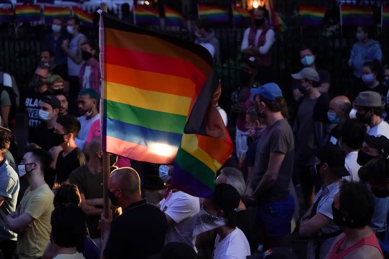 People attend a rally at the Stonewall Inn to support the Supreme Court decision to uphold LBGTQ+ workplace rights in New York
