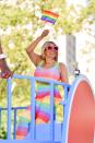 The talk show host wore a rainbow jumpsuit and pink oversized glitter-adorned sunglasses to N.Y.C.'s Pride March on June 30.