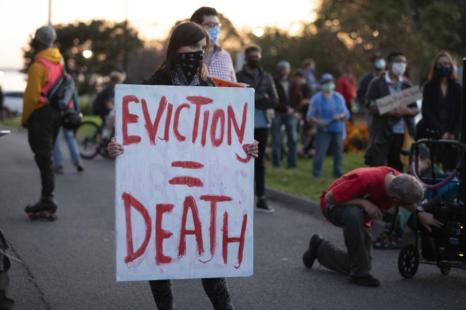 FILE - Housing activists gather in front of Gov. Charlie Baker's house, Wednesday, Oct. 14, 2020, in Swampscott, Mass. Renters are still being evicted during the coronavirus pandemic despite a federal order that is supposed to keep them in their homes. The nationwide eviction ban went into effect Sept. 4 and was supposed to replace many state and local bans that had expired. But tenant advocates said there are still people unaware of the directive implemented by the Centers for Disease Control and Prevention that broadly prevents evictions for nonpayment of rent through the end of 2020. (AP Photo/Michael Dwyer, file)