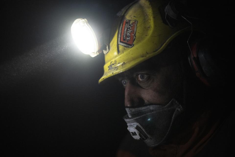 Coal miner Jonny Sandvoll works at the bottom of the Gruve 7 coal mine in Adventdalen, Norway, Monday, Jan. 9, 2023. The last Norwegian coal mine in Svalbard – an archipelago that's one of the world's fastest warming spots – was slated to close this year and only got a reprieve until 2025 because of the energy crisis driven by the war in Ukraine. (AP Photo/Daniel Cole)