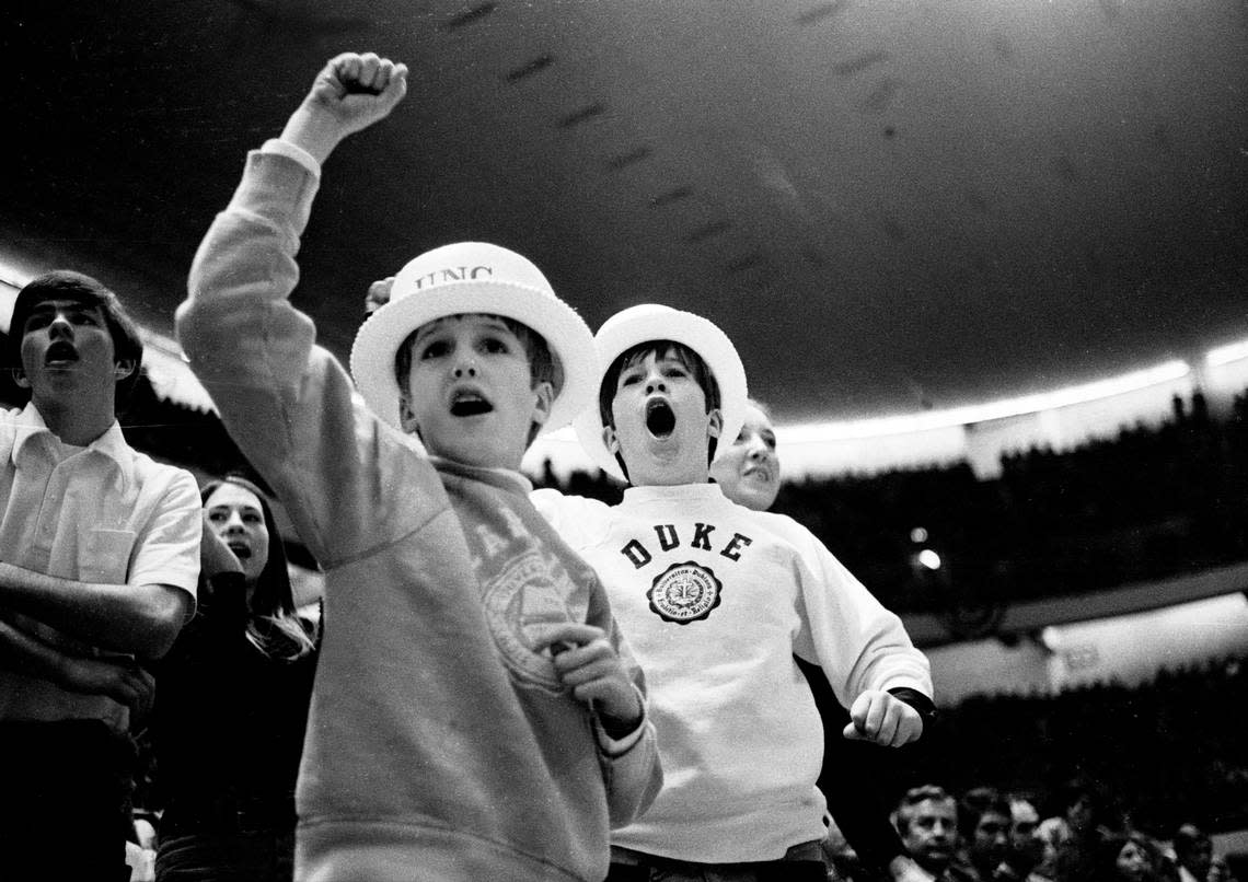 Young North Carolina and Duke fans cheer on the Blue Devils at the 1972 ACC Tournament in Greensboro. File photo