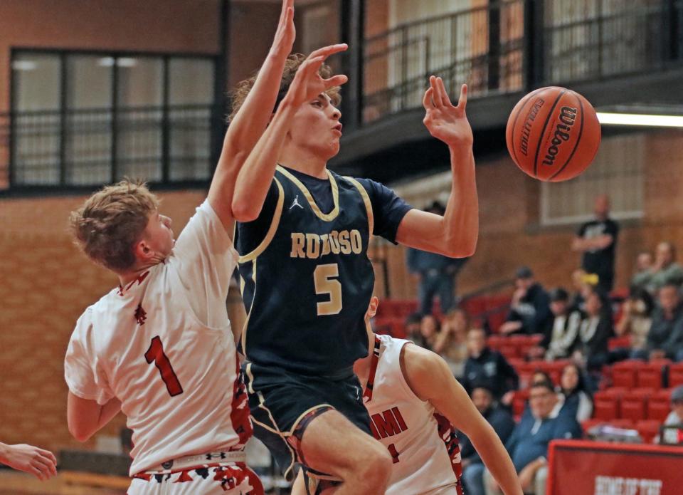 New Mexico Military's Jacob Hayes (left) attempts to stop Ruidoso's Patrick Kimbrell during a Feb. 6, 2024 basketball game in Roswell.