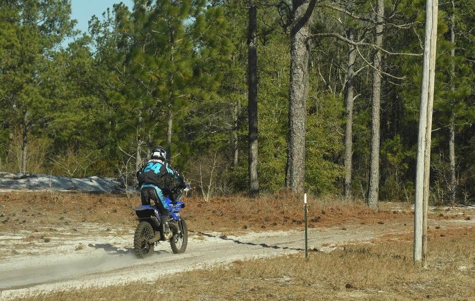 Dirt bikes travel along 532 Carl Meeks Road in Rocky Point on Monday Feb. 6, 2023.