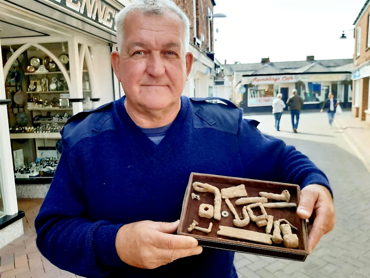 Raymond Kosschuk with some of the artefacts he found. (SWNS)