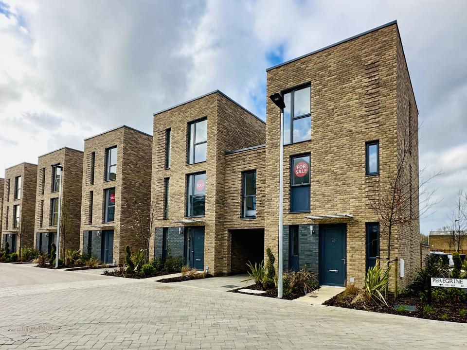 New homes with solar panels for electricity and charging points for electric cars.