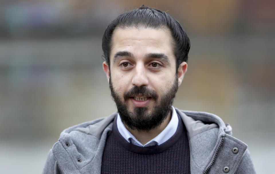 Tareq Alaows, who is running to become a lawmaker at the German parliament Bundestag speaks during an interview with the Associated Press in Berlin, Germany, Wednesday, Feb. 3, 2021. Tareq Alaows fled the civil war in Syria in 2015, crossed the Mediterranean on a flimsy rubber boat and tracked up the Balkans, like over a million migrants looking for a save haven in Germany. Five years on, the 31-year-old Syrian has received asylum, speaks fluent German, has a job, applied for citizenship and launched his campaign to run for federal elections in Germany on Sept. 26, 2021. (AP Photo/Michael Sohn)