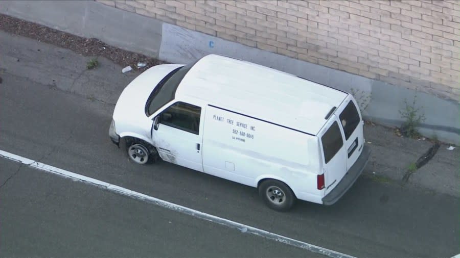 The suspect's van pulled over on the off-ramp at Long Beach Boulevard. (KTLA)