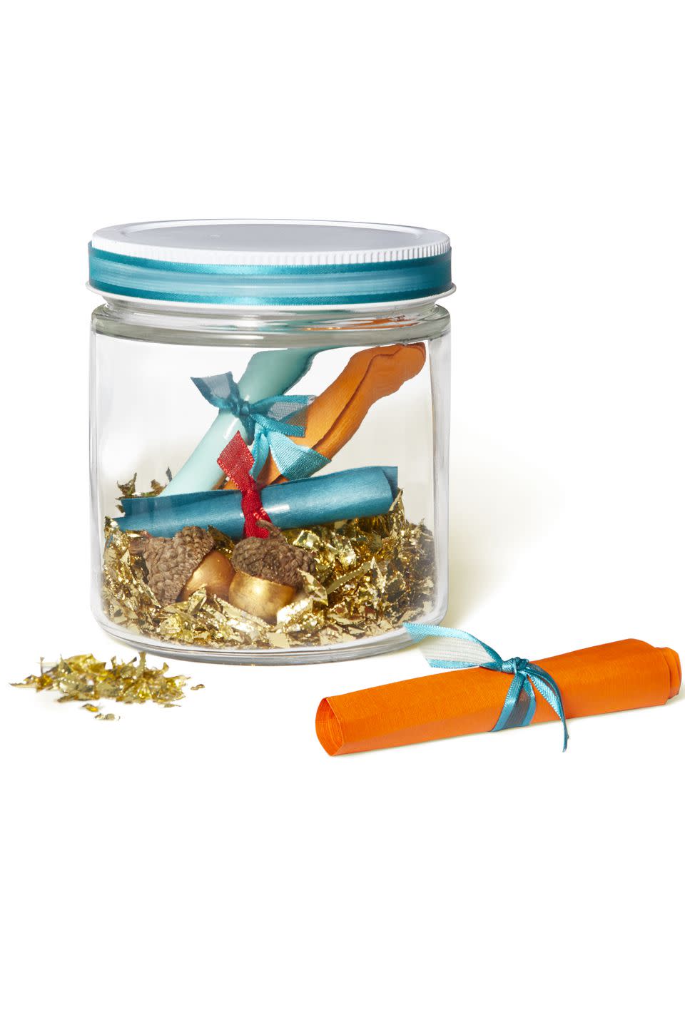 <p>Count your blessings with this colorful time capsule. Fill a small jar with notes and tiny mementos tied with ribbon. Place it inside your cornucopia centerpiece, or display it alone.</p><p><strong>What you'll need: </strong>Glass jar ($18, <a rel="nofollow noopener" href="https://www.amazon.com/NiceBottles-Clear-Glass-Salsa-Jars/dp/B01BVZSIPG" target="_blank" data-ylk="slk:amazon.com;elm:context_link;itc:0;sec:content-canvas" class="link ">amazon.com</a>), Assorted ribbon ($9, <a rel="nofollow noopener" href="https://www.amazon.com/Fun-Express-Assorted-Curling-Ribbon/dp/B007BD9T06" target="_blank" data-ylk="slk:amazon.com;elm:context_link;itc:0;sec:content-canvas" class="link ">amazon.com</a>)</p>