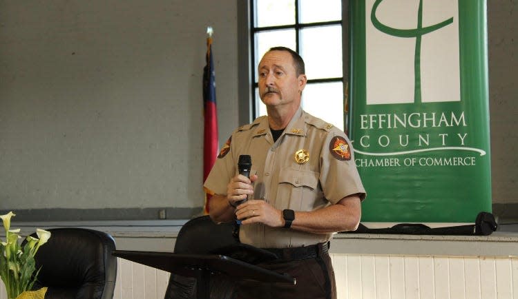 Chief Deputy Richard Bush from the Effingham County Sheriff's Office talks to the crowd during the state legislative breakfast.