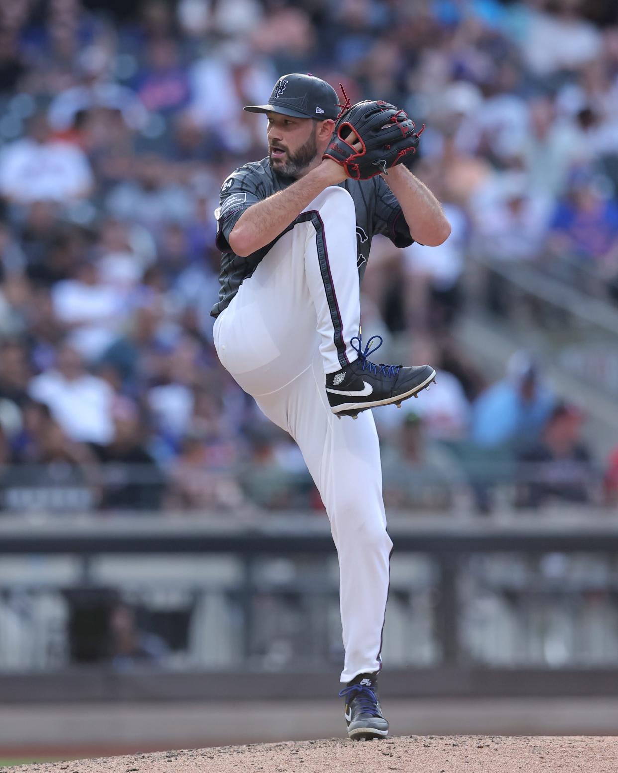 New York Mets relief pitcher Alex Young (46) pitches against the Atlanta Braves during the ninth inning on July 27, 2024, at Citi Field.