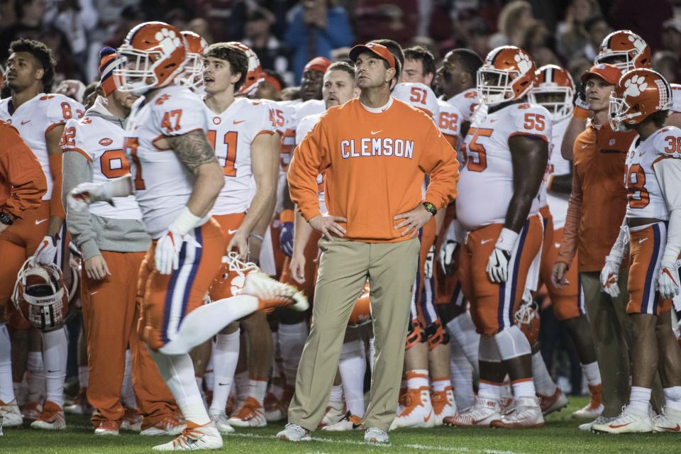Clemson head coach Dabo Swinney stands with his team before an NCAA college football game against South Carolina on Saturday, Nov. 25, 2017, in Columbia, S.C. Clemson defeated South Carolina 34-10. (AP Photo/Sean Rayford)
