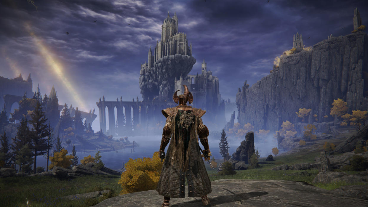  A screenshot from Elden Ring, showing the player character looking out over a wide, fantasy vista. 