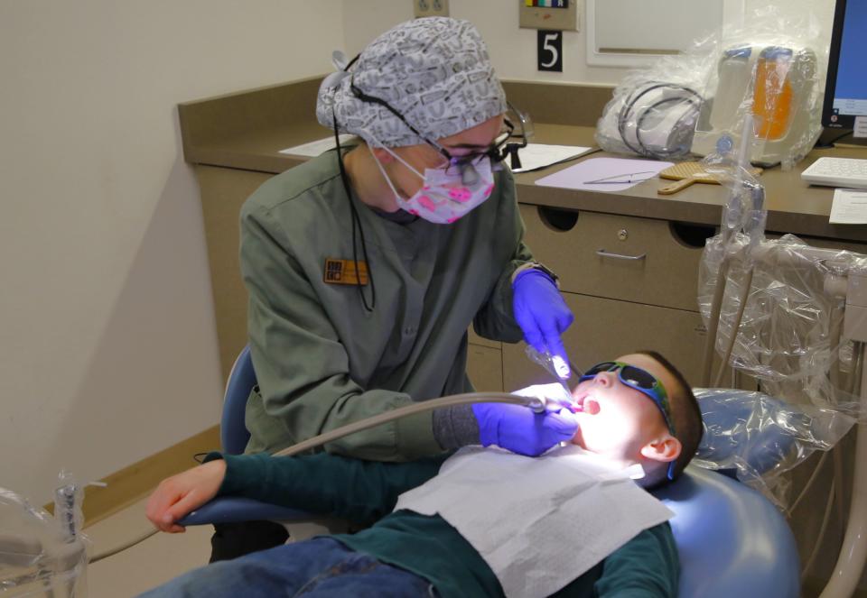 Patients at the 21st annual Give Kids a Smile Day dental clinic at San Juan College were provided with free examinations, cleanings, X-rays and other services.