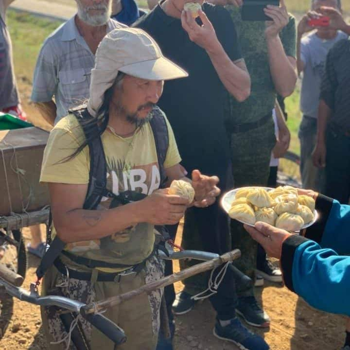 Locals greet Kremlin critic and shaman Alexander Gabyshev with traditional dumplings - Facebook