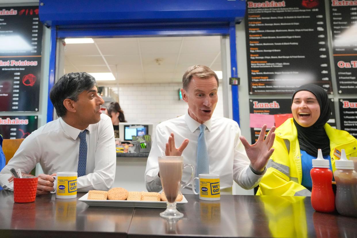 Prime Minister Rishi Sunak and Chancellor of the Exchequer Jeremy Hunt meet staff during a visit to a builders merchant in south east London, after the Chancellor delivered his Budget at the Houses of Parliament. Picture date: Wednesday March 6, 2024.