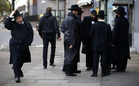 Jewish men talk in Golders Green, London, January 10, 2015. REUTERS/Paul Hackett