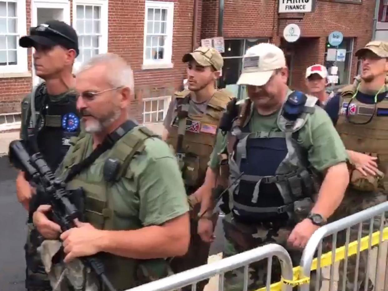 Apparent militia members carrying assault rifles and other weapons march through Charlottesville, Virginia: Craig Stanley