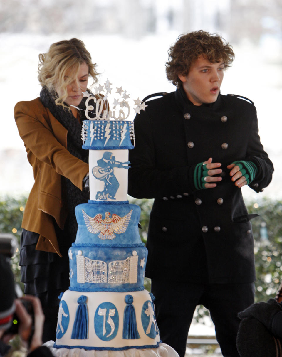 Elvis Presley's grandchildren, Riley Keough, 21, left, and Benjamin Keough, 18, right, take part in a ceremony commemorating Elvis Presley's 75th birthday on Friday, Jan. 8, 2010 in Memphis, Tenn. (AP Photo/Mark Humphrey)