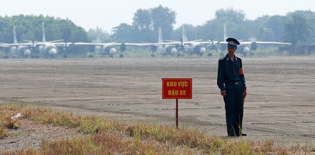 A Vietnamese soldier stands guard in front of military aircraft near a dioxin contaminated area while U.S. Secretary of Defense Jim Mattis (not pictured) visits Bien Hoa airbase, where the U.S. army stored the defoliant Agent Orange during the Vietnam War, in Bien Hoa city, outside Ho Chi Minh City, Vietnam October 17, 2018. REUTERS/Kham/Pool