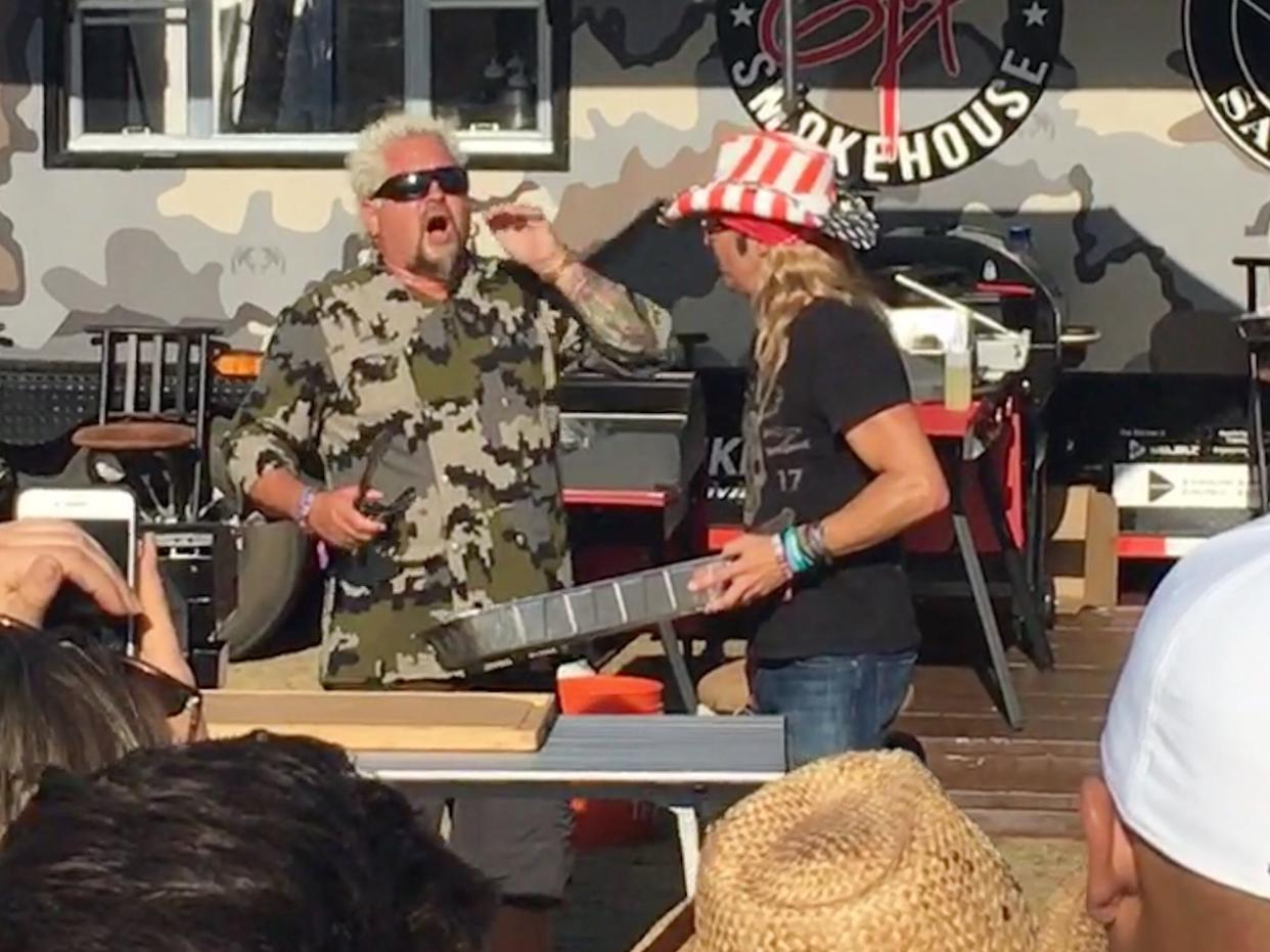 Guy Fieri takes Bret Michaels to flavortown at Guy's Stagecoach Smokehouse at Stagecoach country music festival in Indio, Calif., on April 26, 2019.