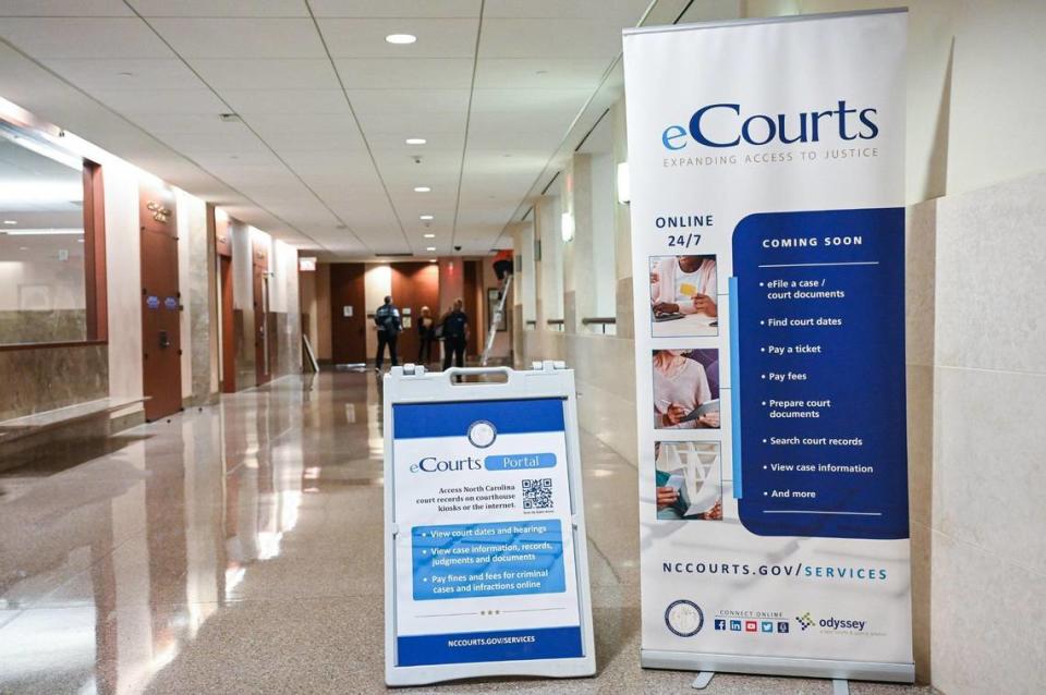 Signs displayed throughout the Mecklenburg County Courthouse on Sept. 21 announce the upcoming launch of eCourts there. The software from Tyler Technologies rolled out in Mecklenburg County in October.