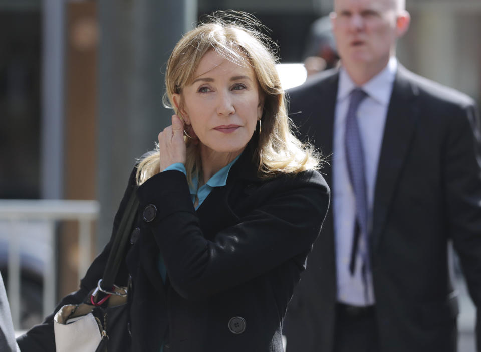 Actress Felicity Huffman arrives at federal court in Boston on Wednesday, April 3, 2019, to face charges in a nationwide college admissions bribery scandal. (AP Photo/Charles Krupa)